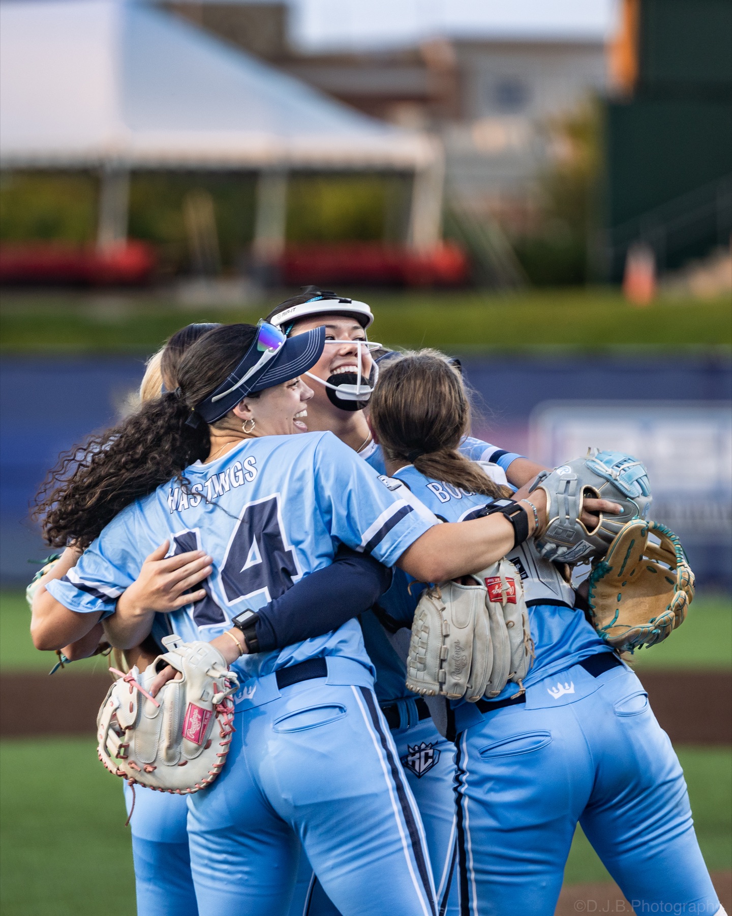 Kansas City Diamonds teammates celebrating together on the field