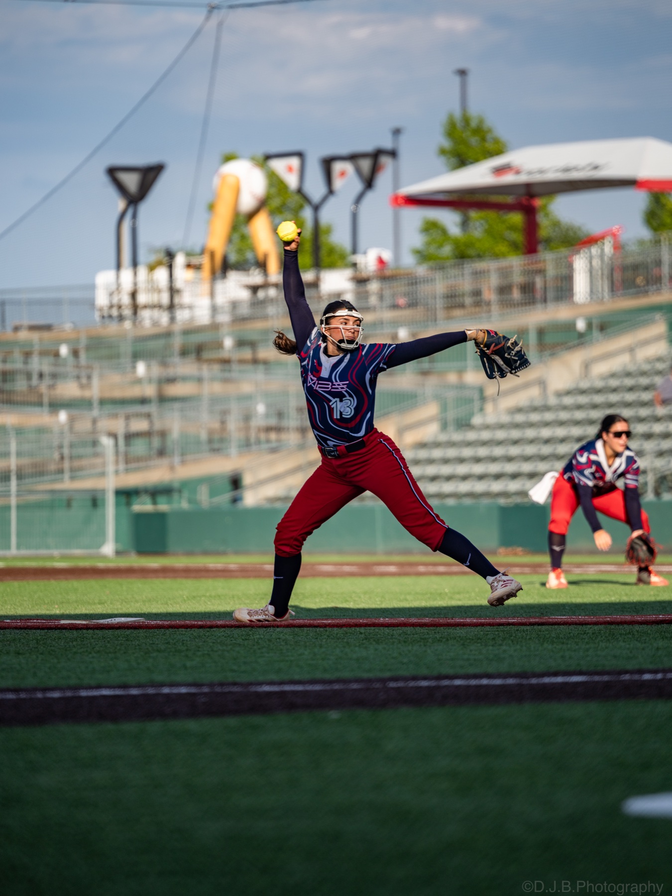 A Florida Vibe pitcher delivers a softball during a game